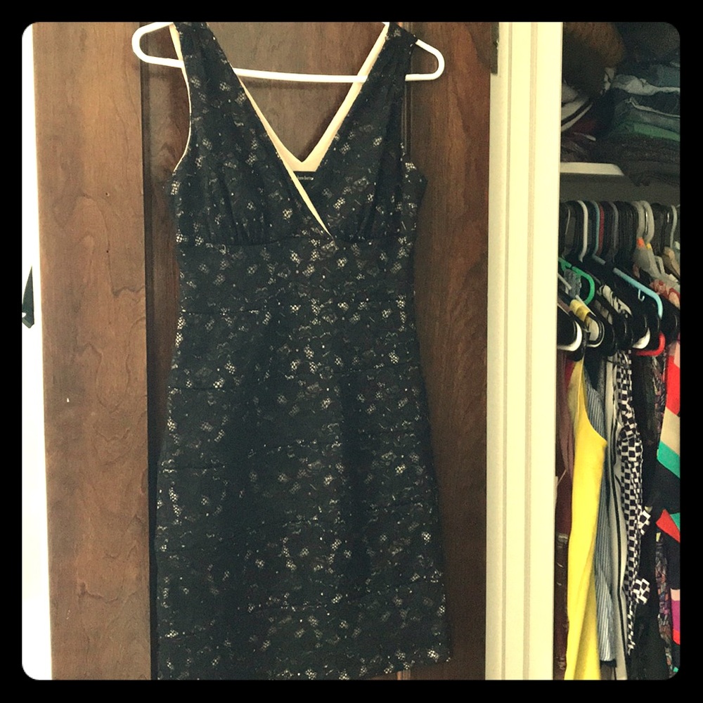 Tight fitted, curvy but elegant black lace dress